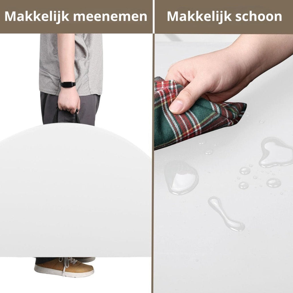 Witte ronde tafel ingeklapt meenemen aan het handvat en blad schoonvegen